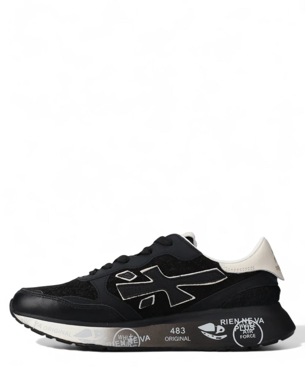 Sneakers Lauryn 7803 Premiata nere con tallone bianco e design moderno, ideali per outfit invernali eleganti e confortevoli.